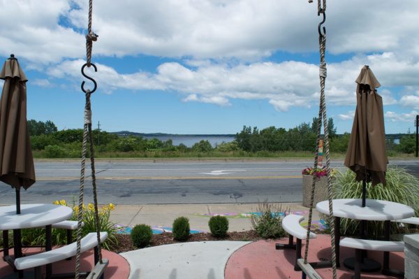 View of Muskegon Lake from swing on patio of flower and gift shop.