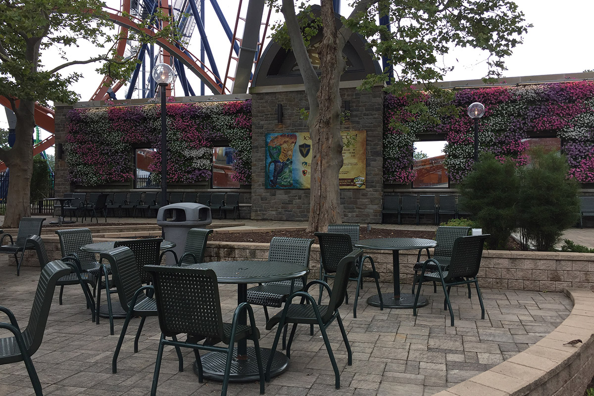 Cedar Point in Sandusky Ohio has a living wall facing the seating area adjacent to the Valravn Roller Coaster.
