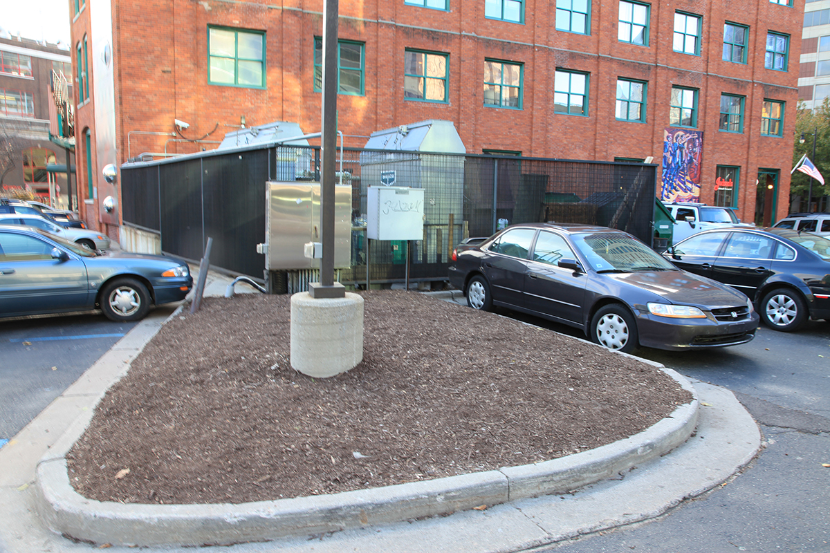 Dumpsters and Mechanical Equipment in parking lot.