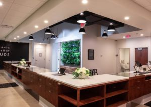 A bright green LiveWall living wall accents The Forest of Sandusky's interior